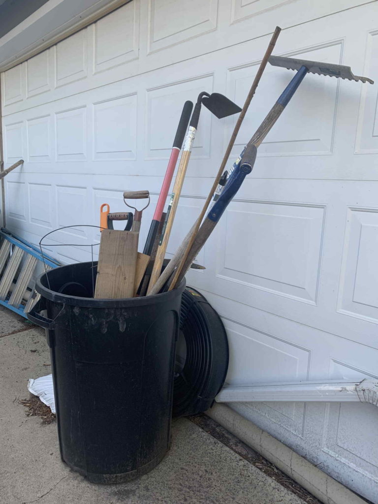 Garbage bin as yard tool storage
