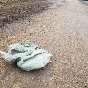 An abandoned plastic bag on a trail